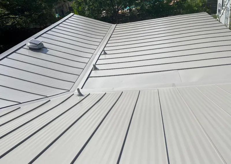 Solar attic fan installed on a metal roof for Roof Ventilation in Morgan Hill